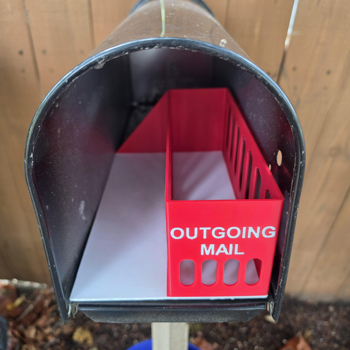 Outgoing mail organizer in a mailbox, showing the side slots