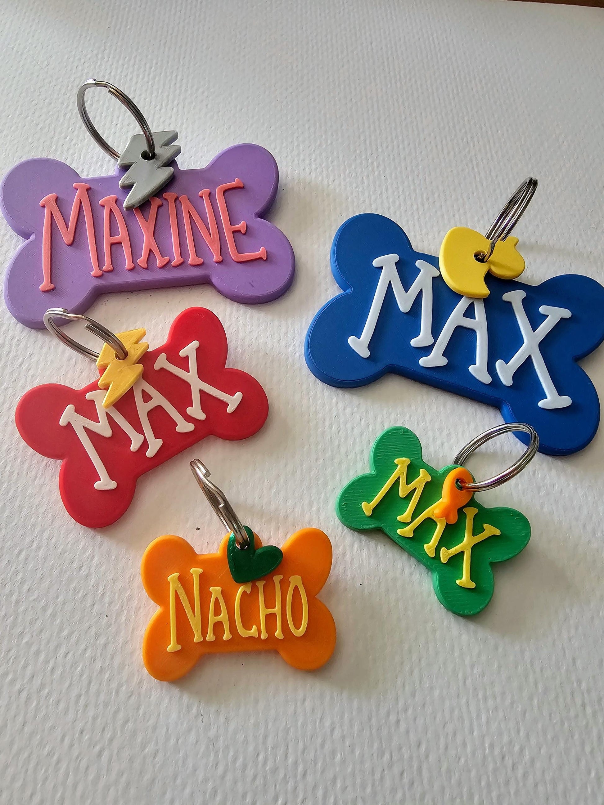 Bone tags with names Maxine, Max, and Nacho