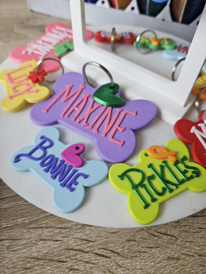 Group of bone tags shown as keychains in several colors