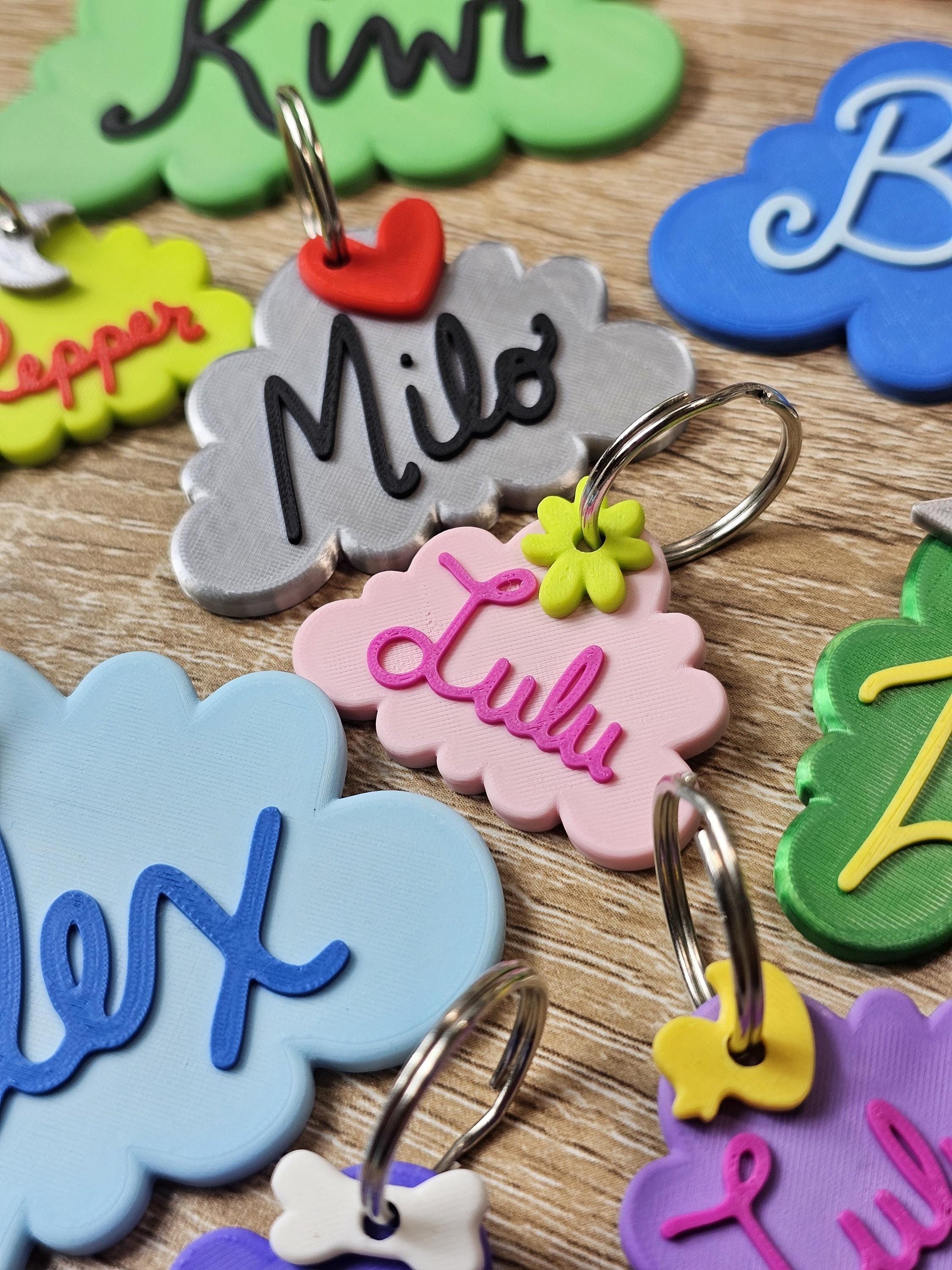 Personalized cloud pet ID tags in multiple colors with names