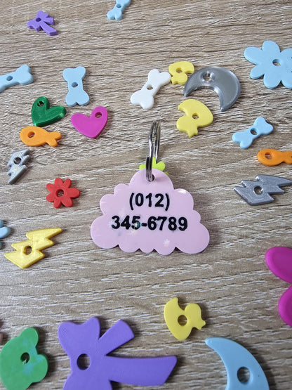 Two-sided cloud tag showing a phone number on the back