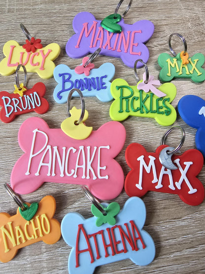 Personalized bone pet ID tags in multiple colors with names