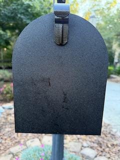 Black replacement door on a small metal mailbox, front view