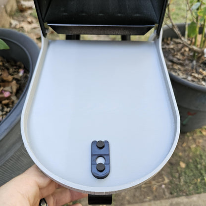 White replacement door open on a metal mailbox, inside face with latch