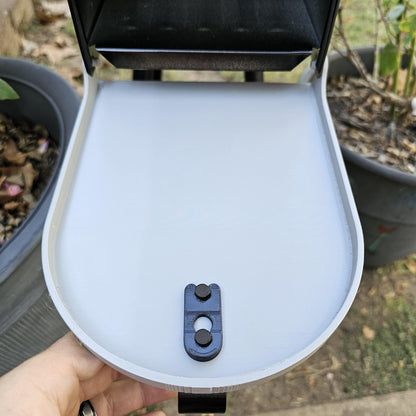 White replacement door open on a metal mailbox, inside face with latch