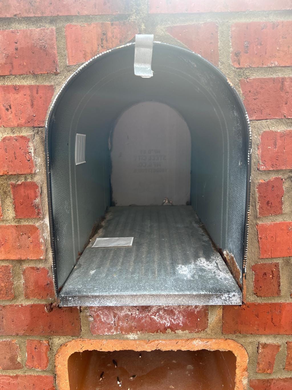 Large metal mailbox opening measured about 11 inches wide
