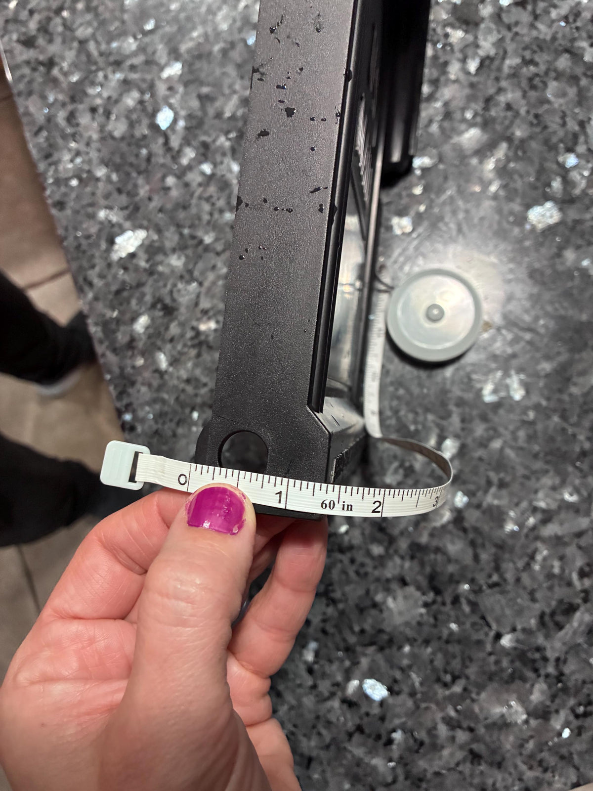 Edge of the original Design 6 mailbox door with a tape measure