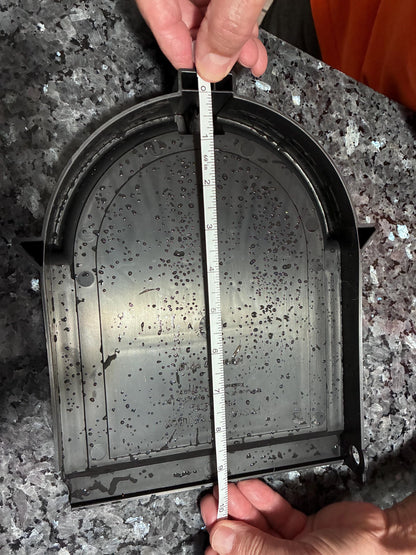 Back of the original Design 6 mailbox door with a tape measure