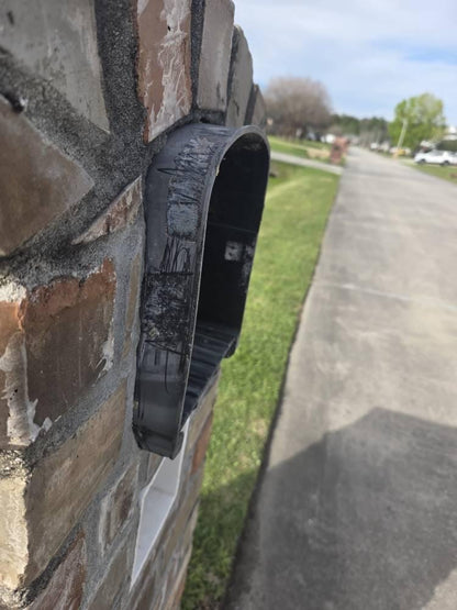 Side view of the Design 9 mailbox in a brick pillar