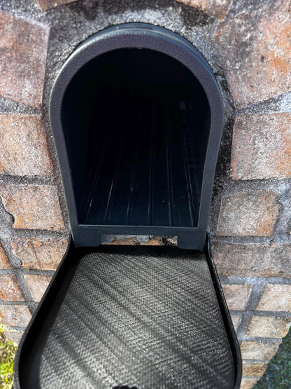 Design 7 mailbox in a brick surround with the replacement door open