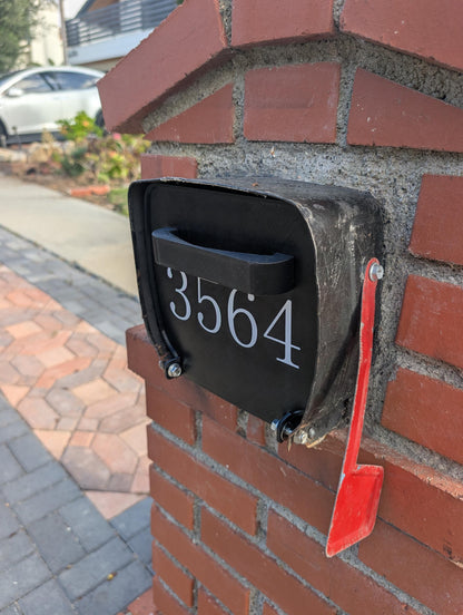 Square metal mailbox replacement door installed, angled view