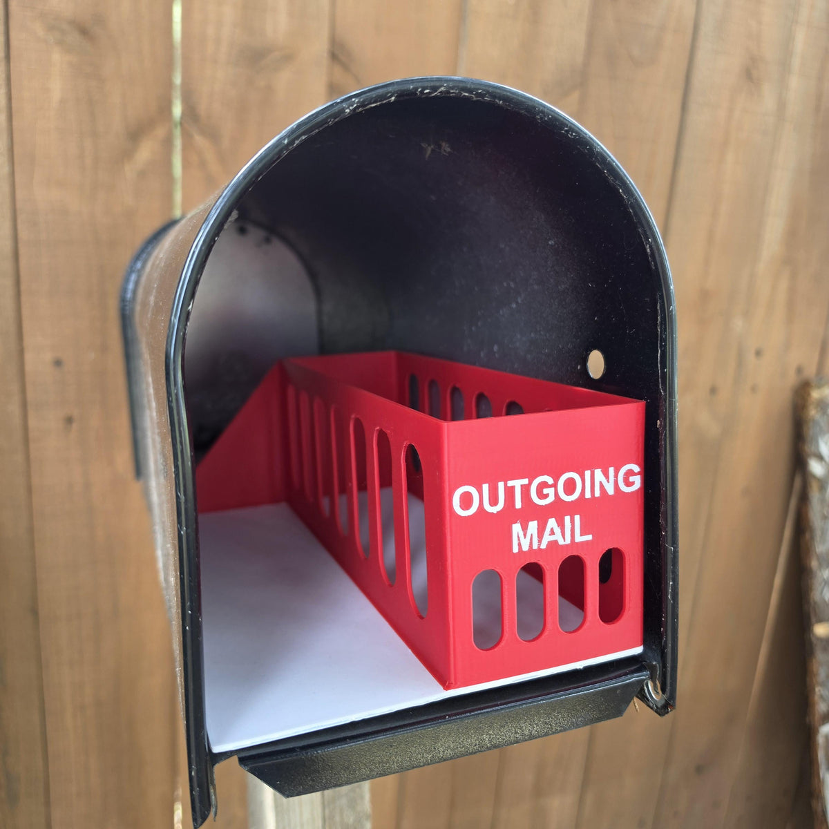 Outgoing mail bin with open slots and flat white sorting tray
