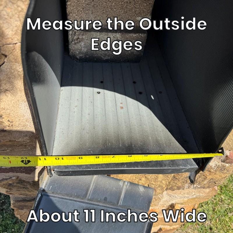 Measuring the outside edges of a large metal mailbox, about 11 inches wide