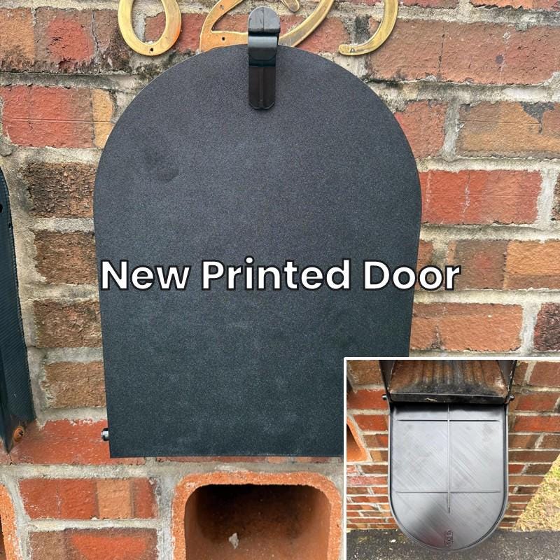 New 3D printed replacement door installed on a large metal mailbox