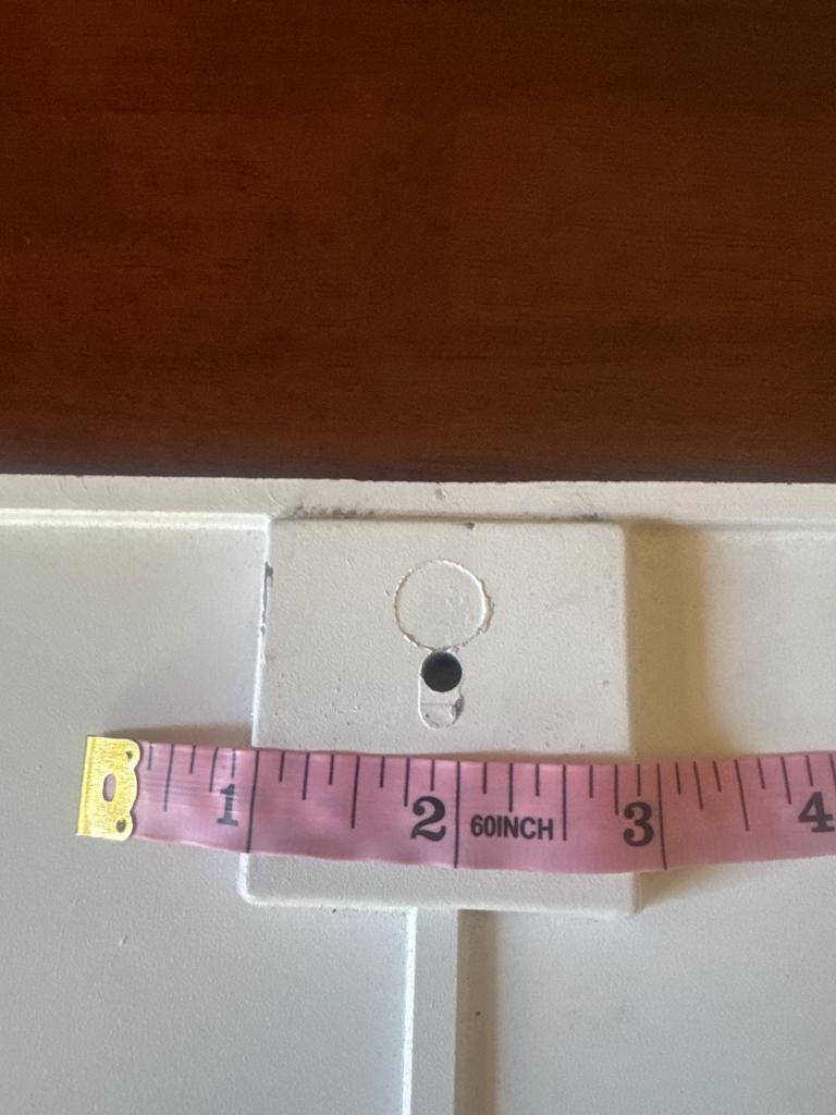 Latch mount on the original door with a tape measure, width