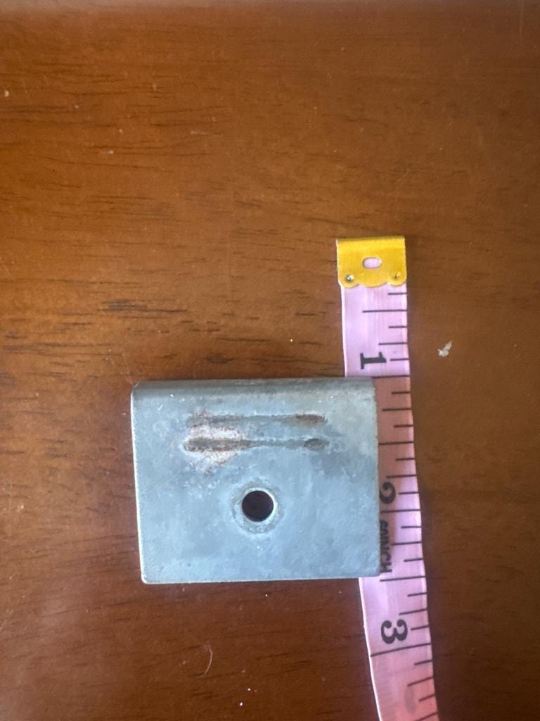 Original latch plate with a tape measure, first dimension