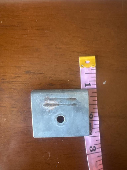 Original latch plate with a tape measure, first dimension