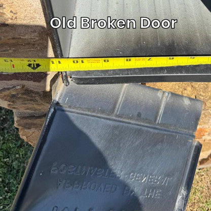 Old broken door from a large metal mailbox